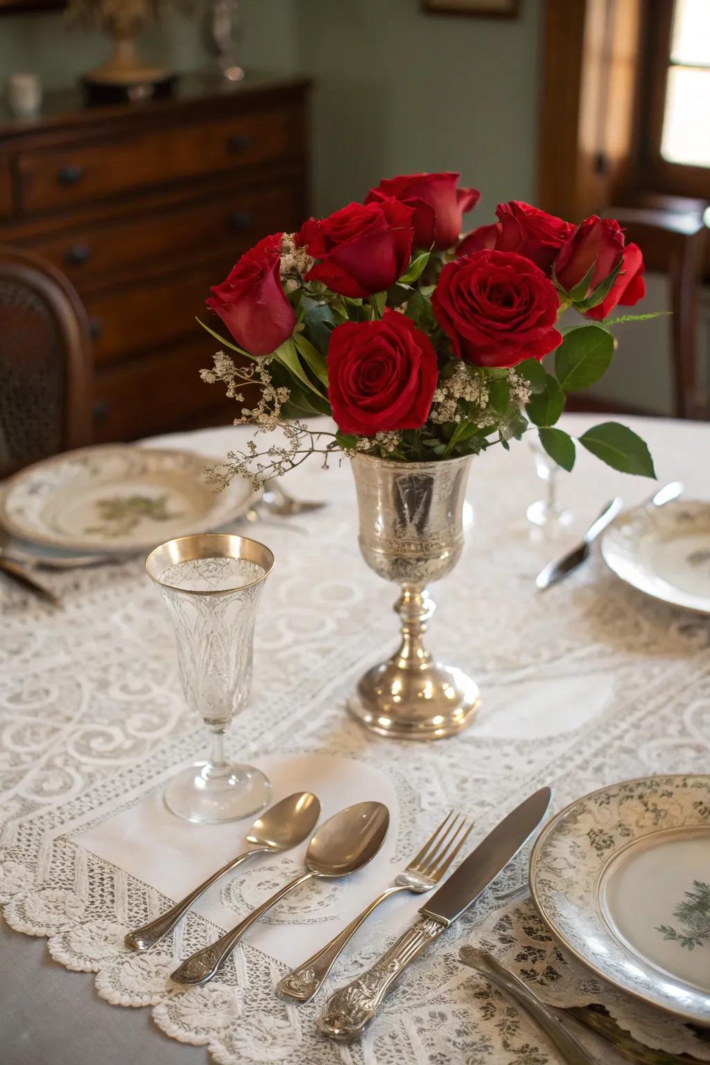 Classic display that comes with classic silverware along with scarlet flowers displaying classic gracefulness.