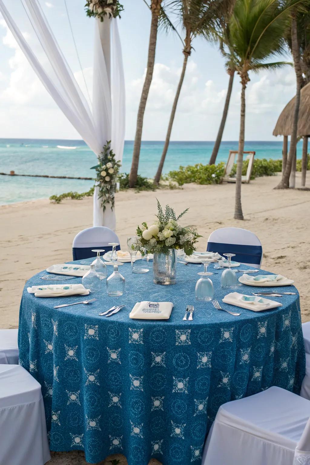 Ocean-inspired table covering for a serene seaside wedding.